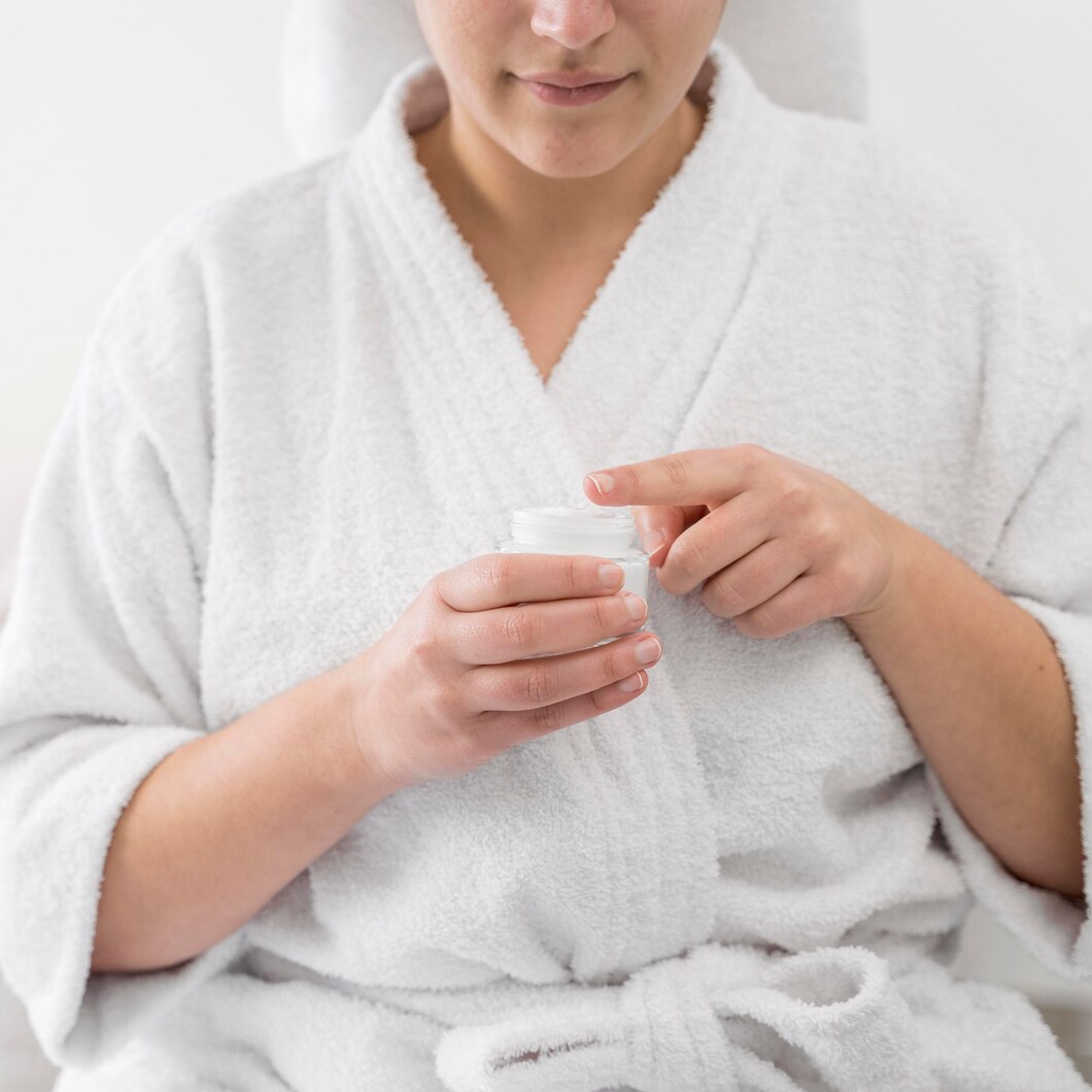 close up woman holding cream container 23 2148708048